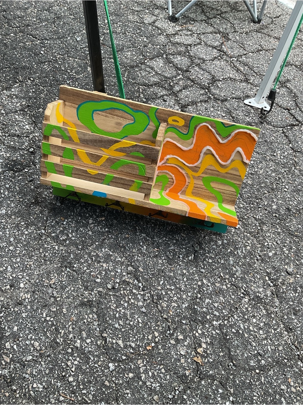 Hand-Painted Wooden Display Rack with Bright Abstract Design